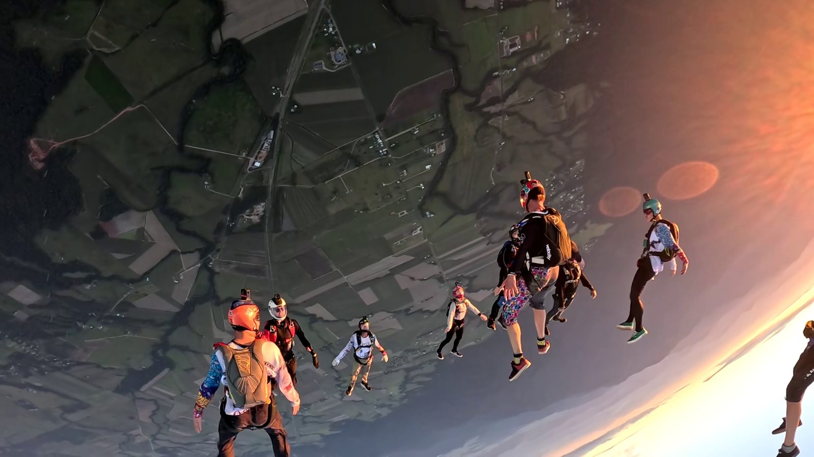Overhead view of a big-way angle from the god slot: a row of back flyers and a second row, then a row of belly flyers and a second row, showing head levels and slot spacing.